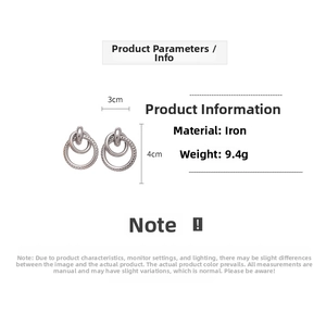 Detail view of geometric hollow circular earrings with size and material specifications