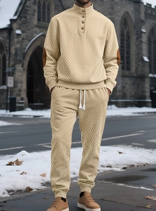 Detailed texture of men knit tracksuit with mock neck buttons and elbow patches