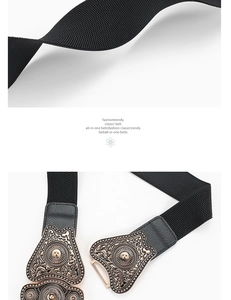 Macro detail of elastic black belt with vintage bronze floral carved metal buckle