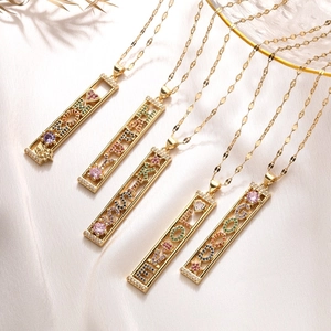 Gold necklaces with MOM LOVE HAPPY LUCK and DOG pendants featuring colorful zircon crystals