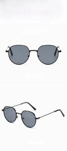 Detailed views of vintage retro round black metal sunglasses with dark lenses