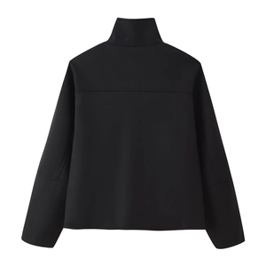 Back view detail of a black long-sleeve mock neck jacket with matte finish texture