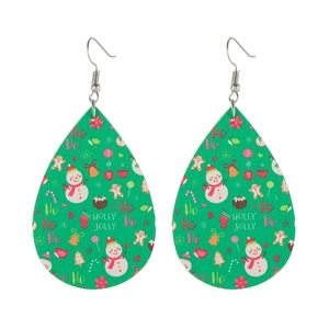 Detailed view of green teardrop leather earrings featuring snowmen and festive patterns