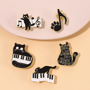 Five-piece black cat music enamel pins set featuring piano keys and musical note designs