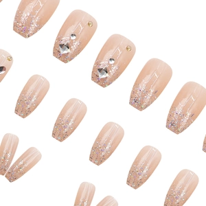 Sparkling nude pink press-on nails with holographic silver glitter and rhinestones