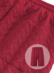 Detailed view of dark red men's shorts showing premium jacquard V-pattern knit texture