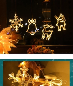 Close-up of snowflake, deer, and Santa LED suction lights with warm white glow for windows