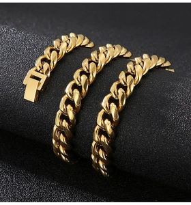 Close-up of polished gold-tone stainless steel Cuban link chain with a secure box clasp