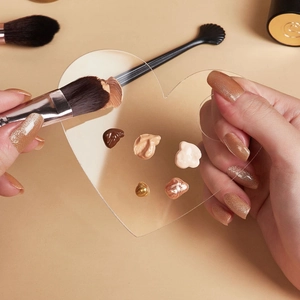 Heart-shaped clear acrylic makeup palette for foundation mixing and beauty blending