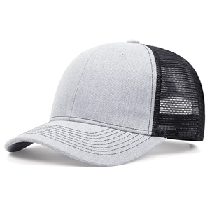 Detail of grey twill fabric and black mesh texture on a trucker baseball cap