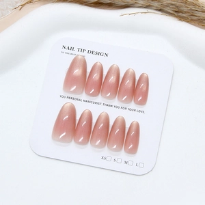 Cat eye glitter press-on nails with soft pink blush gradient on white display card