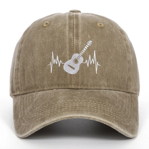 Detail of white guitar heartbeat embroidery on khaki washed cotton baseball cap