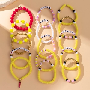 Colorful teacher-themed beaded bracelet set with apple charms and alphabet letters