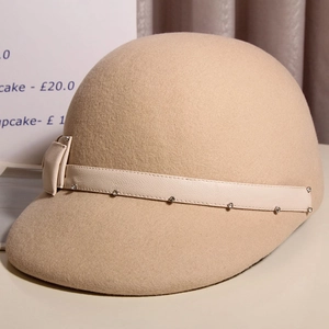 Detail of wool felt equestrian hat showing side bow and rhinestone leather band
