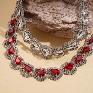 Exquisite teardrop red rhinestone necklace and earring set with a luxury silver finish