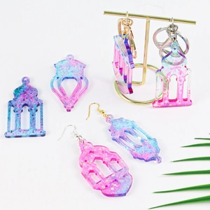 Glitter resin castle lantern earrings with colorful gradient and metallic hangers