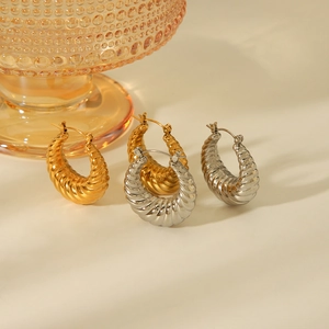 18K gold and silver hollow croissant hoop earrings with classic spiral texture for women