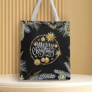 Detail of Christmas canvas handbag with golden Merry Christmas print and festive ornaments