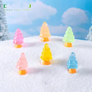 6-piece set of colorful glowing miniature Christmas tree ornaments on artificial snow