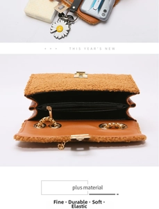 Detailed view of caramel fleece crossbody bag with gold lock and interior compartments