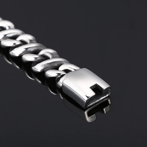 Close-up of titanium steel necklace with square clasp and silver metallic chain link