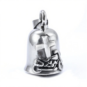 Polished stainless steel motorcycle guardian bell with cross relief on white background