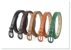 Detail view showing five colors of slim PU leather belts with classic metal pin buckles
