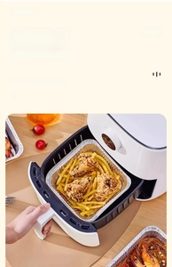 Square aluminum foil tray for air fryer containing crispy fried chicken and french fries