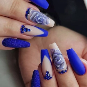 Long coffin fake nails with blue matte finish, glitter, hand-painted roses, and rhinestones