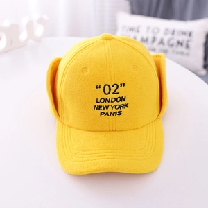 Detail of yellow fleece winter hat for kids with embroidered 02 London urban text design