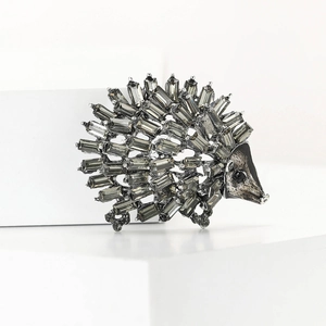 Hedgehog brooch featuring grey rectangular rhinestones on a dark alloy base