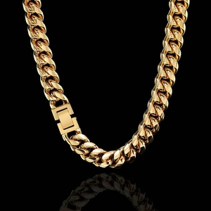 Close-up of golden Cuban link chain with rectangular clasp on a black background