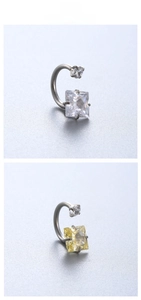 Macro shot of horseshoe rings with square and round cubic zirconia in silver steel