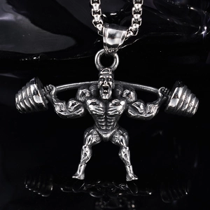 Macro shot of silver barbell weightlifter pendant with stainless steel chain