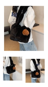 Detail of black faux fur shoulder bag featuring a cute brown biscuit plush pendant