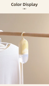 Hanging closet dehumidifier with yellow capsule design and transparent water tank