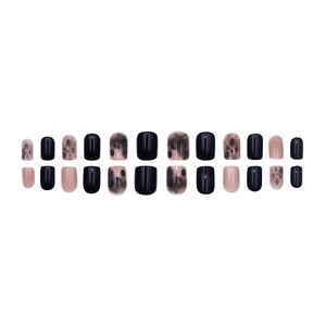 Black and champagne gold press-on nails with amber leopard print and glossy finish