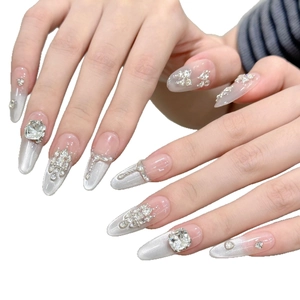 Silver cat eye press-on nails with luxury crystal rhinestones and pink gradient detail