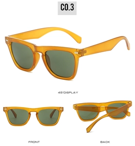 Detailed views of vintage amber sunglasses with dark green lenses and metal rivets
