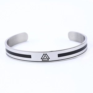 Detailed view of silver stainless steel Viking Valknut cuff with black enamel stripes