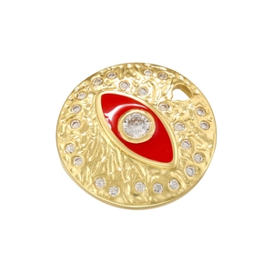 Macro detail of gold round evil eye pendant with red enamel and clear zircon stones