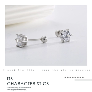 Macro shot of silver six-pointed star stud earrings with sparkling cubic zirconia inlay