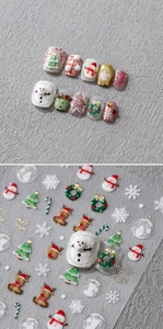 Detail of Christmas nail stickers with 3D snowman and reindeer patterns for holiday manicure