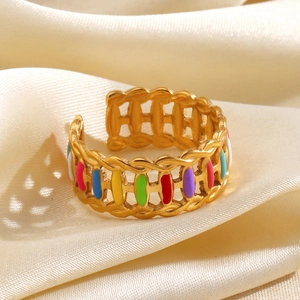 Colorful enamel rainbow open ring in gold finish on a soft beige satin background