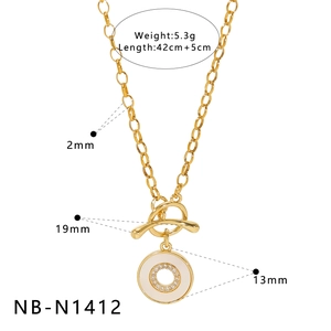 Golden OT clasp necklace with white enamel double ring pendant and sparkling crystals
