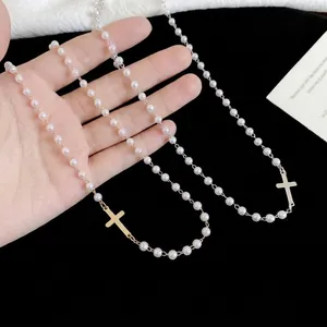 French cross pendant pearl necklace in gold and silver finish with elegant white beads