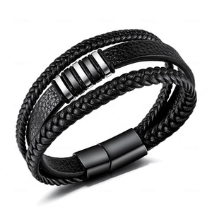 Detailed view of multilayer black woven leather bracelet with magnetic buckle and silver bars