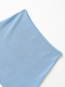Macro view showing ribbed texture and knit craftsmanship of light blue denim style jacket