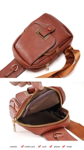 Detail view of brown vintage PU leather chest bag with golden zippers and interior capacity