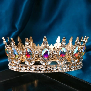Macro detail of luxury bridal tiara with colorful pear-cut gems and rhinestones on silk